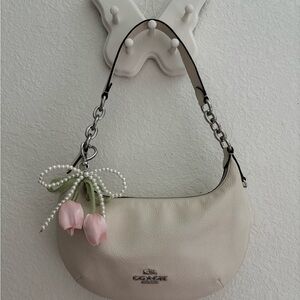 Coach Pebbled Leather Peyton Shoulder Bag in Cream with Pink bag charm